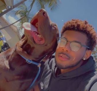 Chris Seeley with his pet dog, Koda