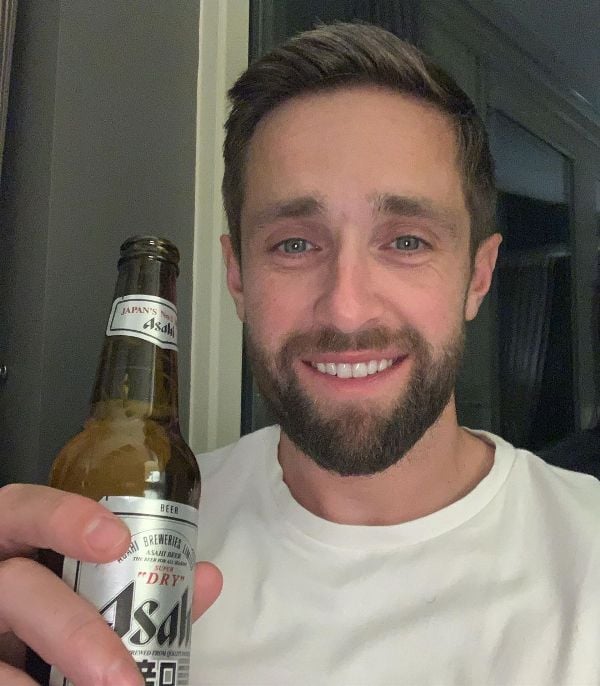 Chris Woakes with a pint of beer