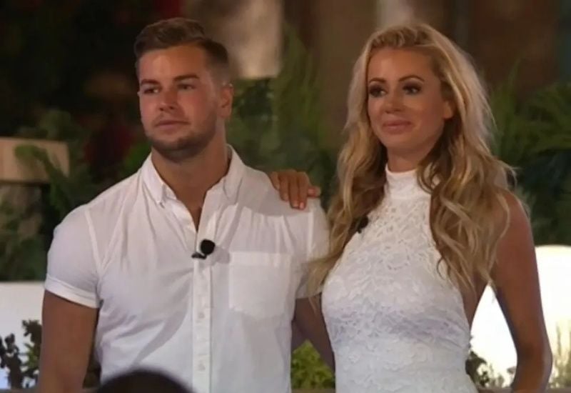 Christopher Hughes with Olivia Attwood in a still from the third series of the British reality TV show titled 