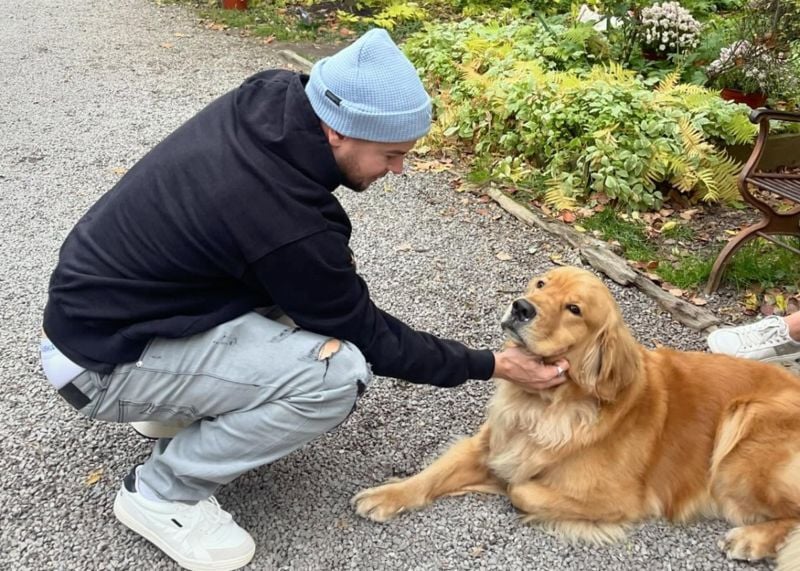 Christopher Hughes with his pet dog