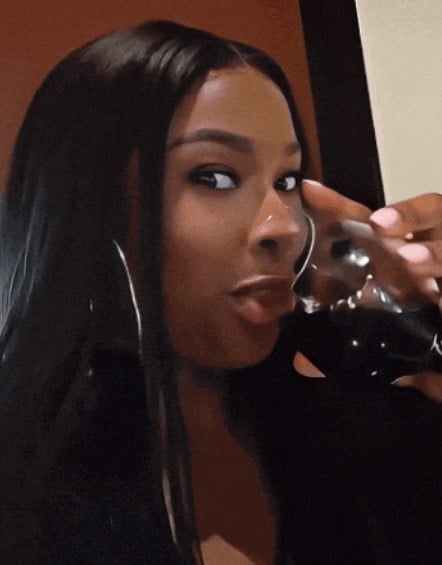 Coco Jones while enjoying an alcoholic beverage