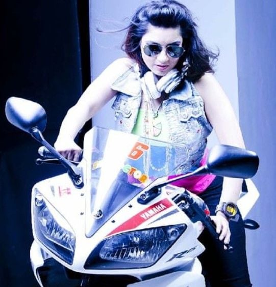 DJ Rink riding a bike