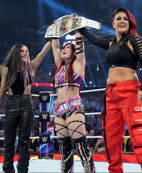 Dakota Kai with Iyo Sky and Bayley (left to right) as part of Damage CTRL