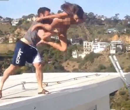 Dan Bilzerian while throwing a model off a house roof
