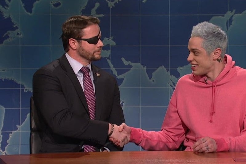 Dan Crenshaw shaking hands with Pete Davidson