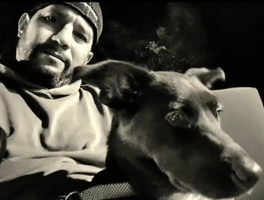 Dan Rivera posing with his pet