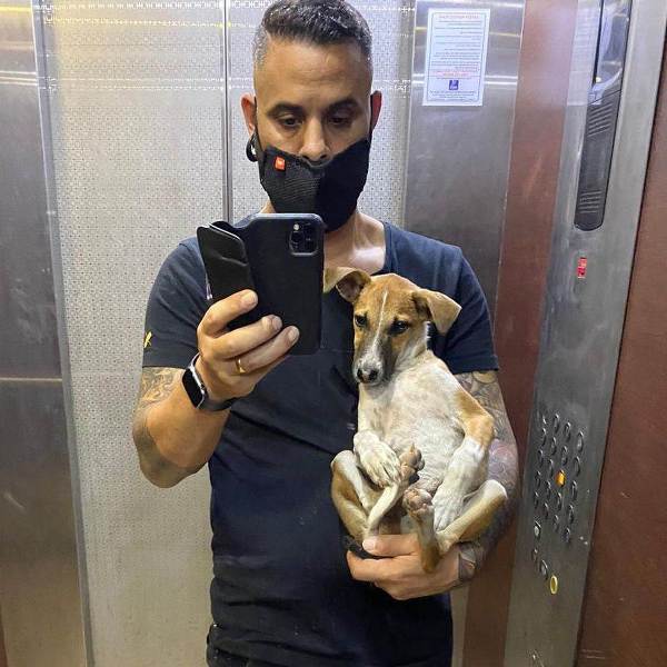 Daniel Bauer with a dog he rescued