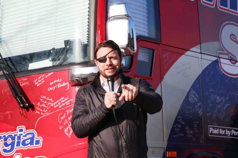 Daniel Crenshaw addressing a gathering during an electoral campaign