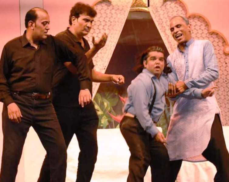 Danish Maqsood (second from right) during a play