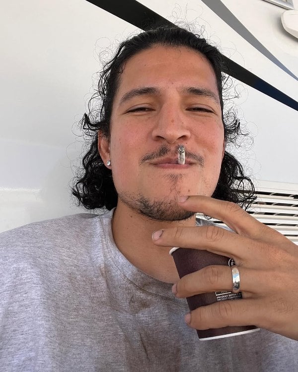 Danny Ramirez, while smoking a cigarette
