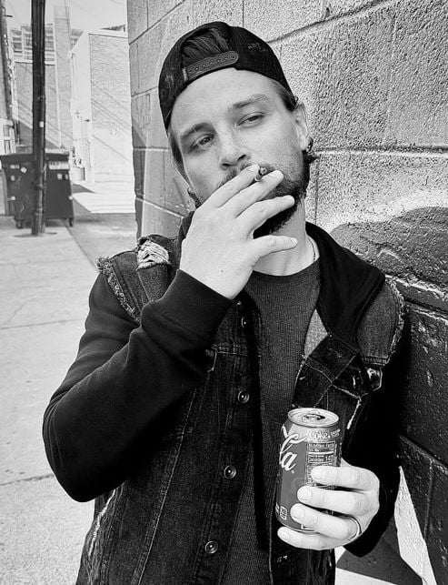 Darren Mann smoking a cigarette