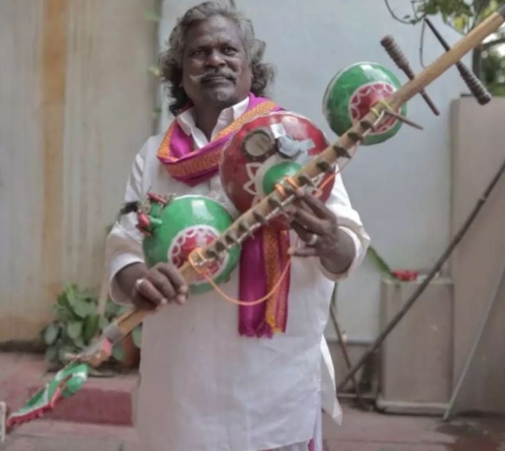 Darshanam Mogilaiah holding kinnera