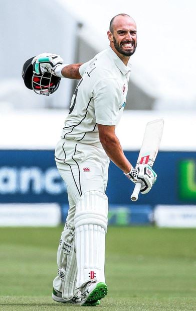 Daryl Mitchell celebrating after scoring a test century