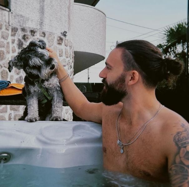 David Maurício with his pet dog
