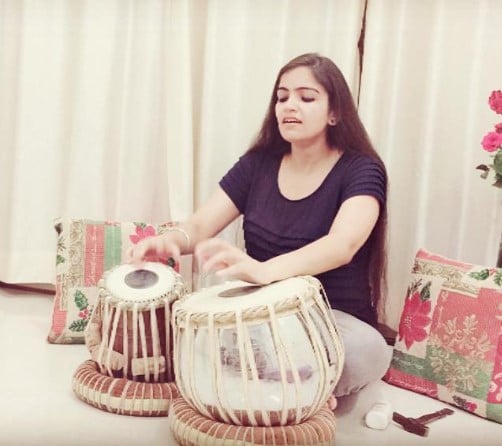 Deedar Kaur while playing tabla