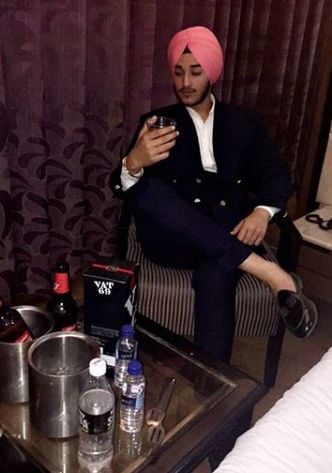 Deep Kalsi with a bottle of whisky