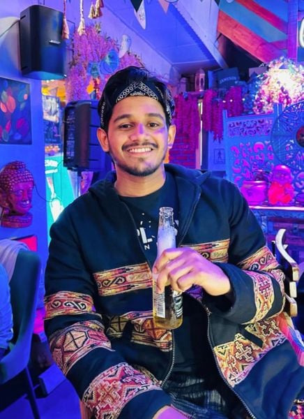 Deepak Chauhan drinking beer