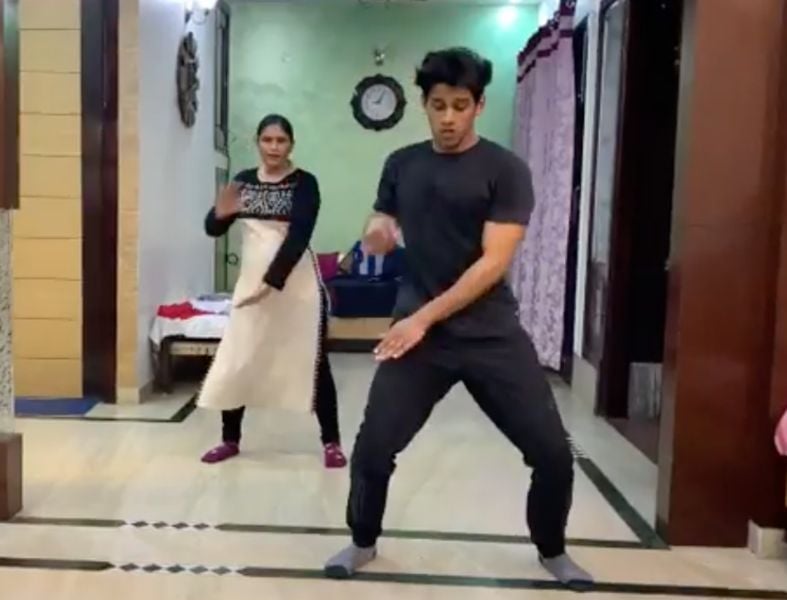 Deepak Chauhan in a still from a dance video with his mother