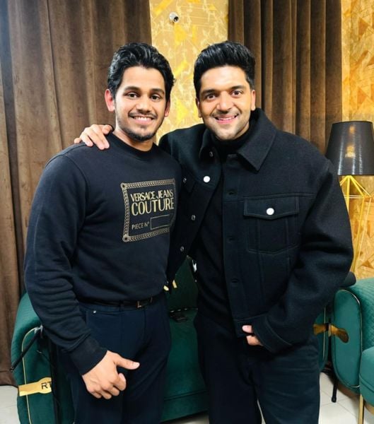 Deepak Chauhan (left) with the Indian singer Guru Randhawa