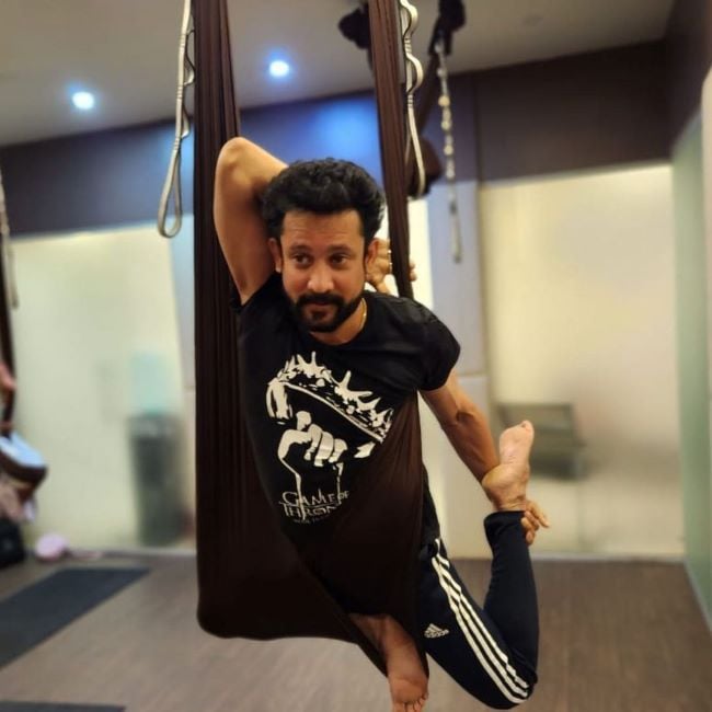 Deepak Dinkar practising aerial yoga