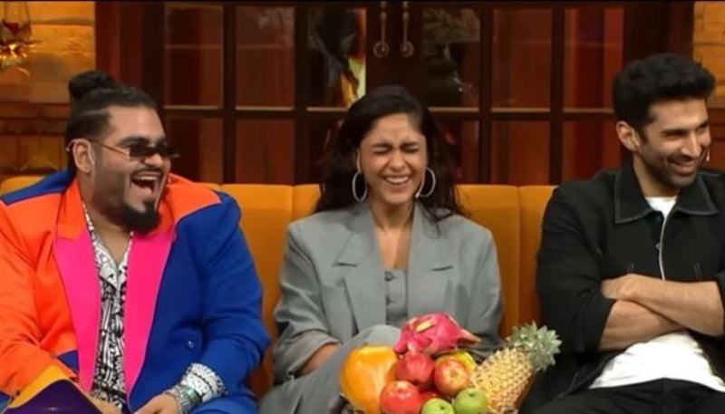 Deepak Kalra (left), along with Mrunal Thakur (centre) and Aditya Roy Kapur (right), in The Kapil Sharma Show (2023)
