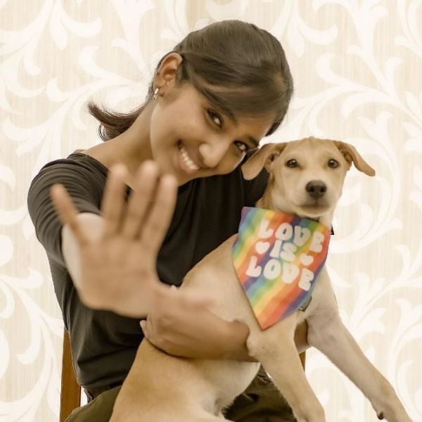 Deepika Venkatachalam playing with a dog