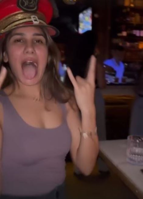 Deepti Mallik with a glass of alcohol