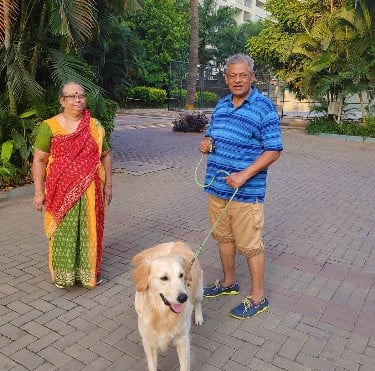 Delhi Ganesh with his wife and their pet dog