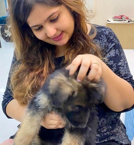 Devashree Sanghvi with a dog