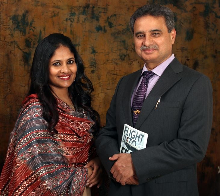 Sarita Patil with Devi Sharan holding Flight Into Fear The Captain