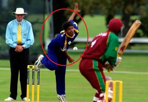 Dhammika Niroshana while bowling during a cricket match in the 2000s