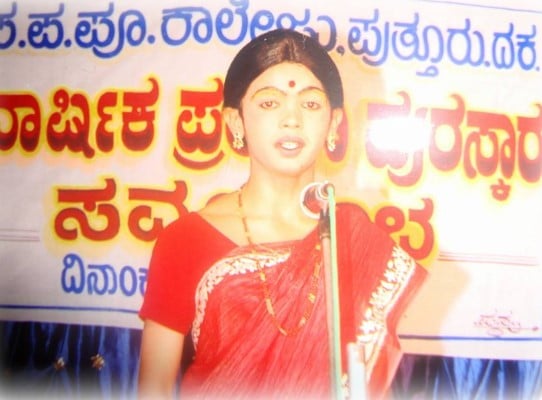 Dhanraj Achar speaking during a school competition