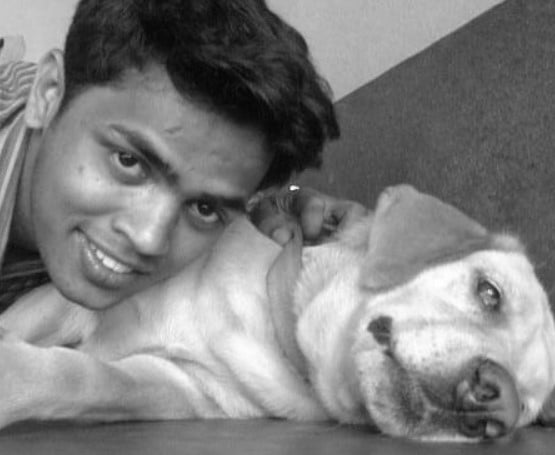 Dhanraj Achar with his pet dog