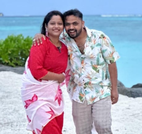 Dhanraj Achar with his wife during a trip