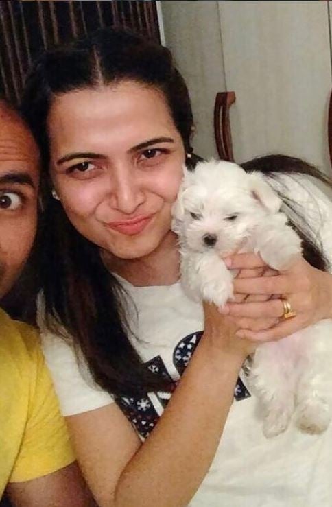Dhivyadharshini with her pet dog