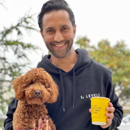 Dhru Purohit posing with his pet dog