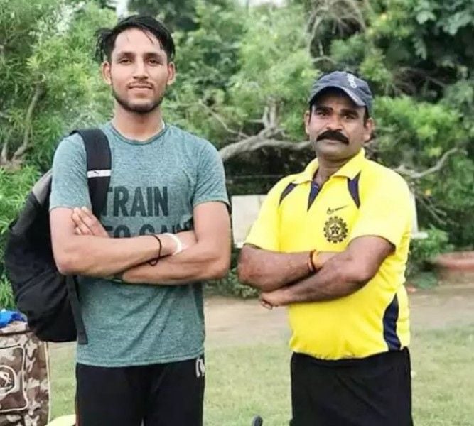 Dhruv Jurel with his coach, Parvendra Yadav