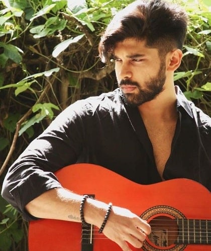 Dhruv Vikram playing the guitar