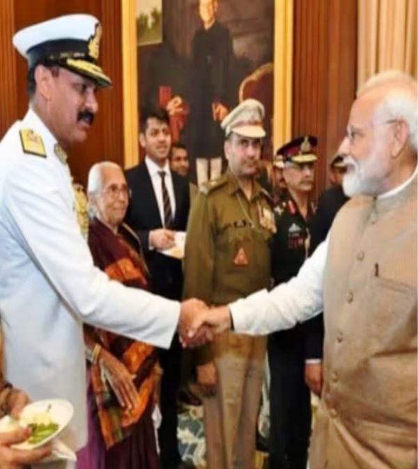 Dinesh being congratulated by Prime Minister Narendra Modi