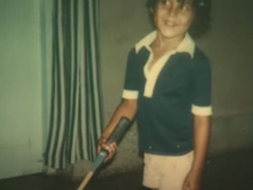 Dino Morea holding a badminton racket