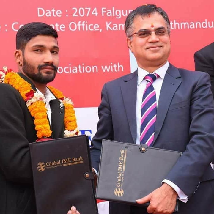 Dipendra Singh Airee (left) while being signed by Global IME Bank Ltd