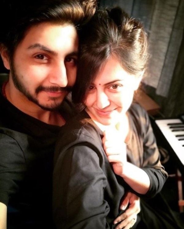 Divya Harjai with her husband learning to play piano