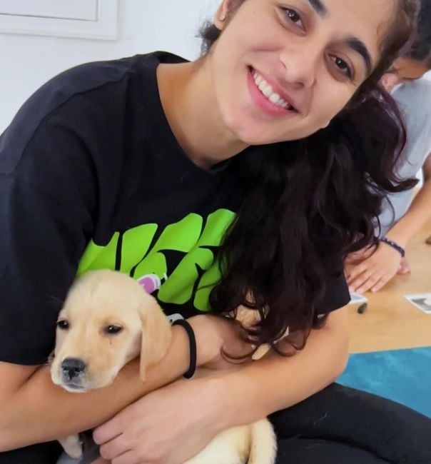 Divya Satija with a puppy