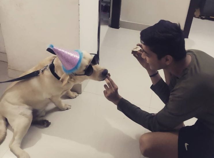 Divyansh Pokharna playing with his dog Danie