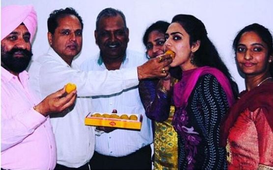 Doctor Hannah celebrating her success with her guardians