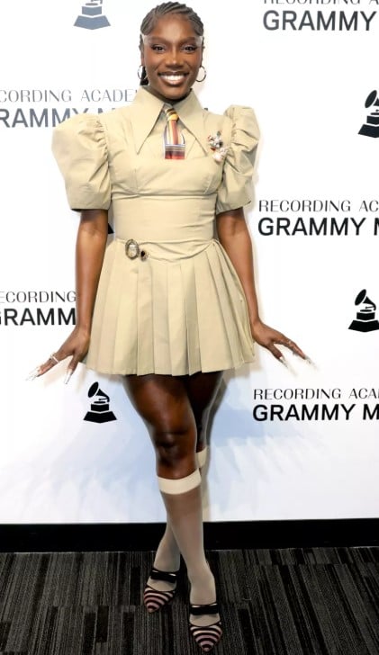 Doechii posing in vintage clothes