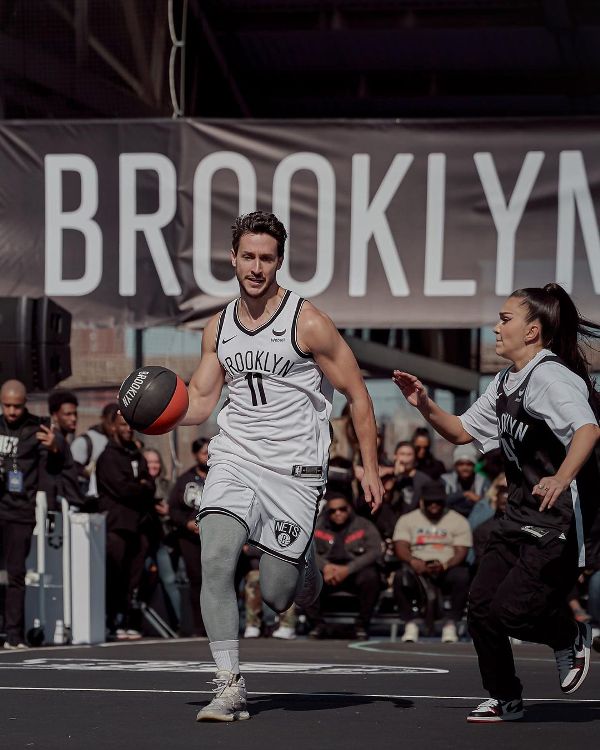 Dr Mike playing basketball at the Annual Celebrity Games