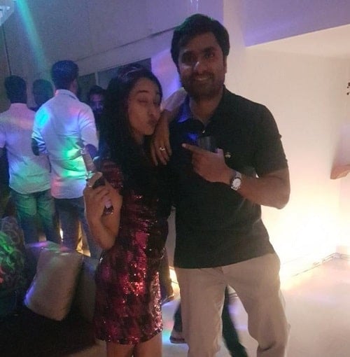 Dr Priti Challa holding a bottle of alcohol