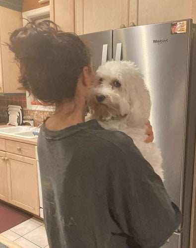 Dylan Gelula with her pet dog