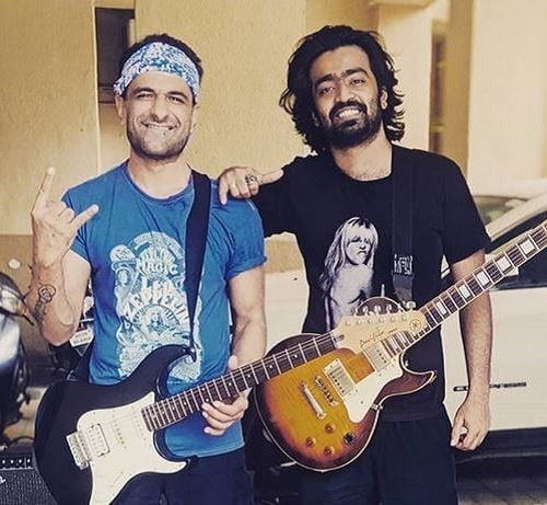 Eijaz Khan Holding His Guitar